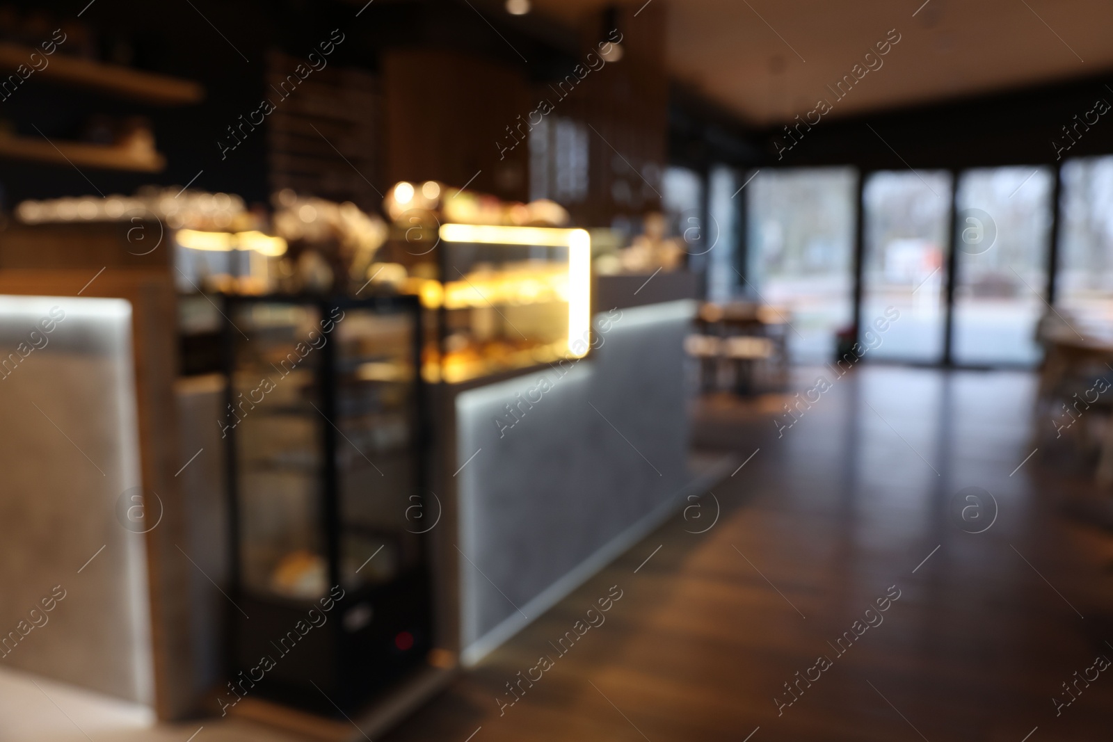 Photo of Blurred view of stylish restaurant with large windows