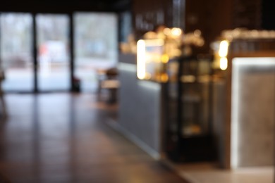 Photo of Blurred view of stylish restaurant with large windows