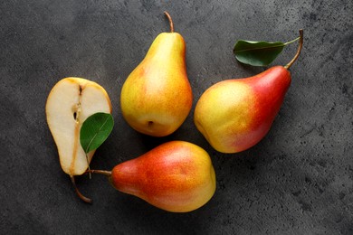 Photo of Ripe juicy pears on grey table, flat lay