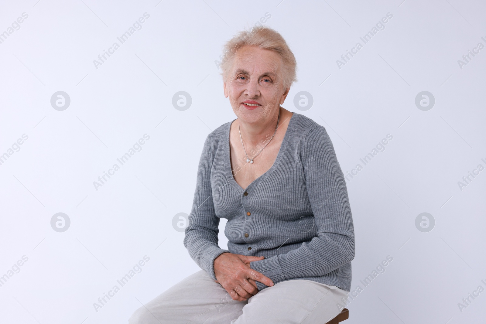 Photo of Portrait of senior woman on white background