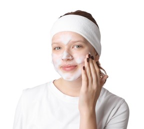 Photo of Teenage girl washing her face with cleanser on white background. Cosmetic product