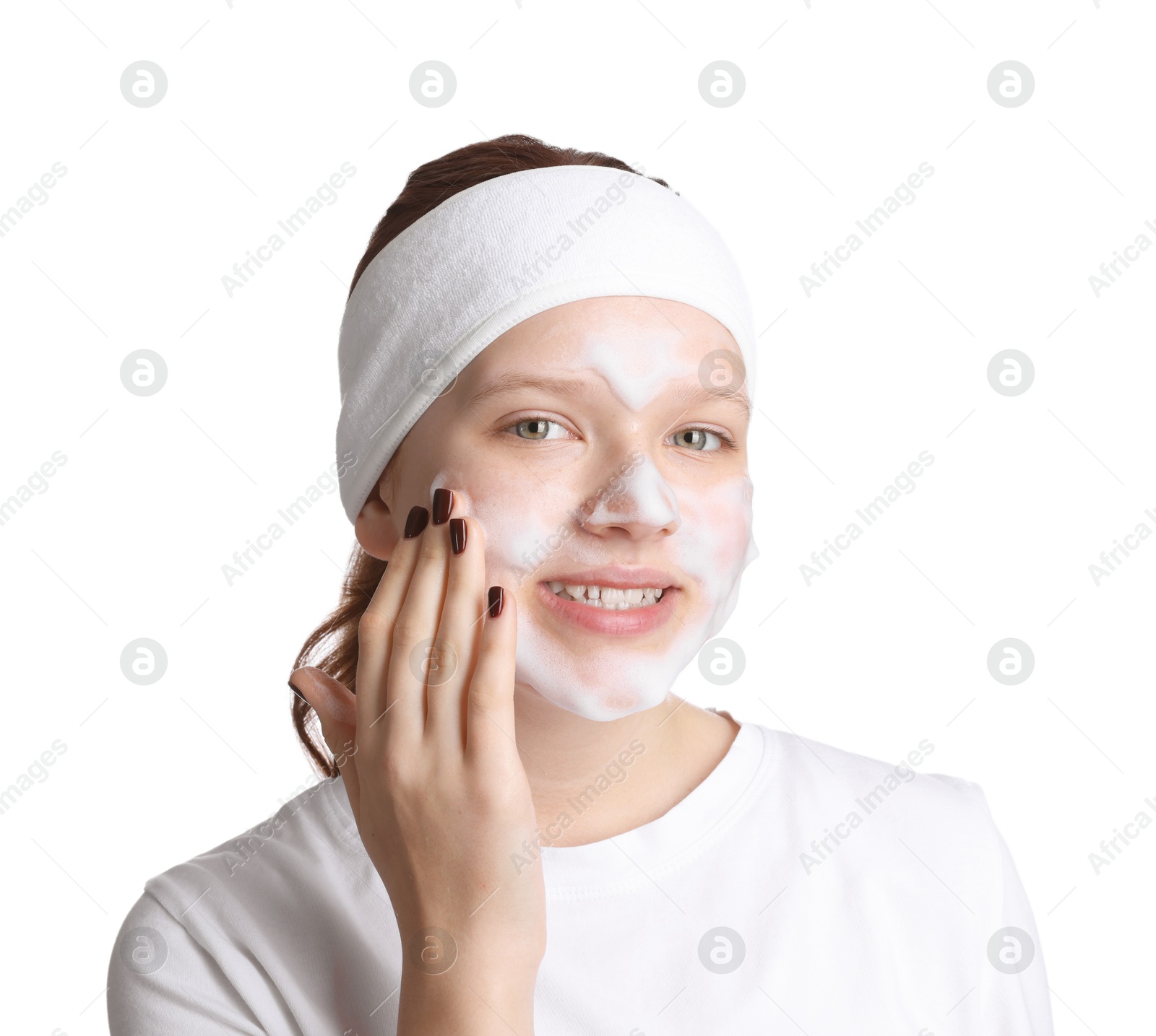 Photo of Teenage girl washing her face with cleanser on white background. Cosmetic product