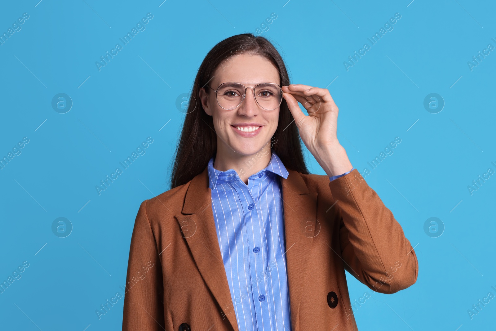 Photo of Portrait of banker in glasses on light blue background