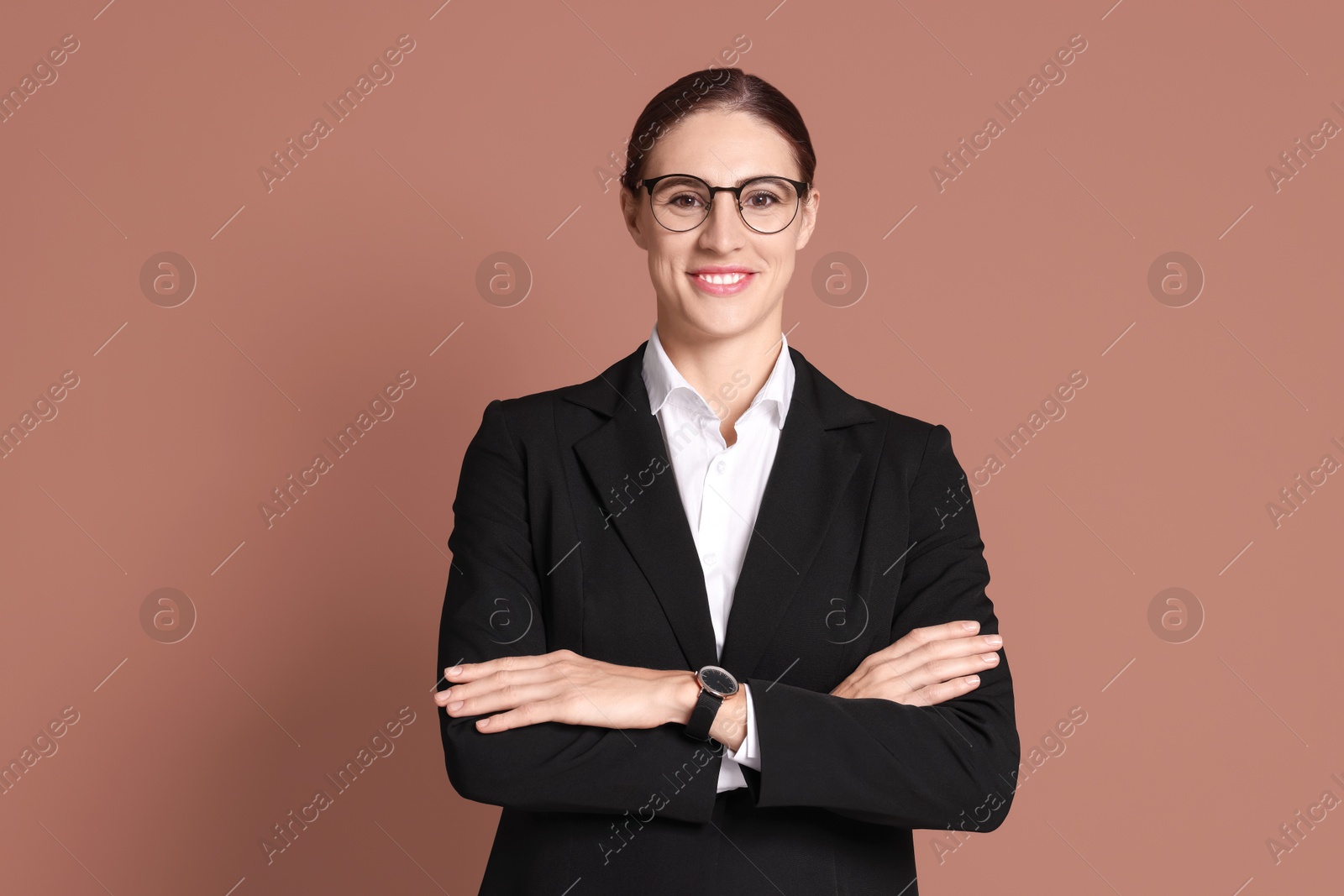 Photo of Portrait of banker in glasses on brown background