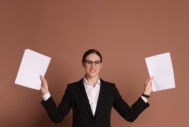 Photo of Portrait of banker with documents on brown background