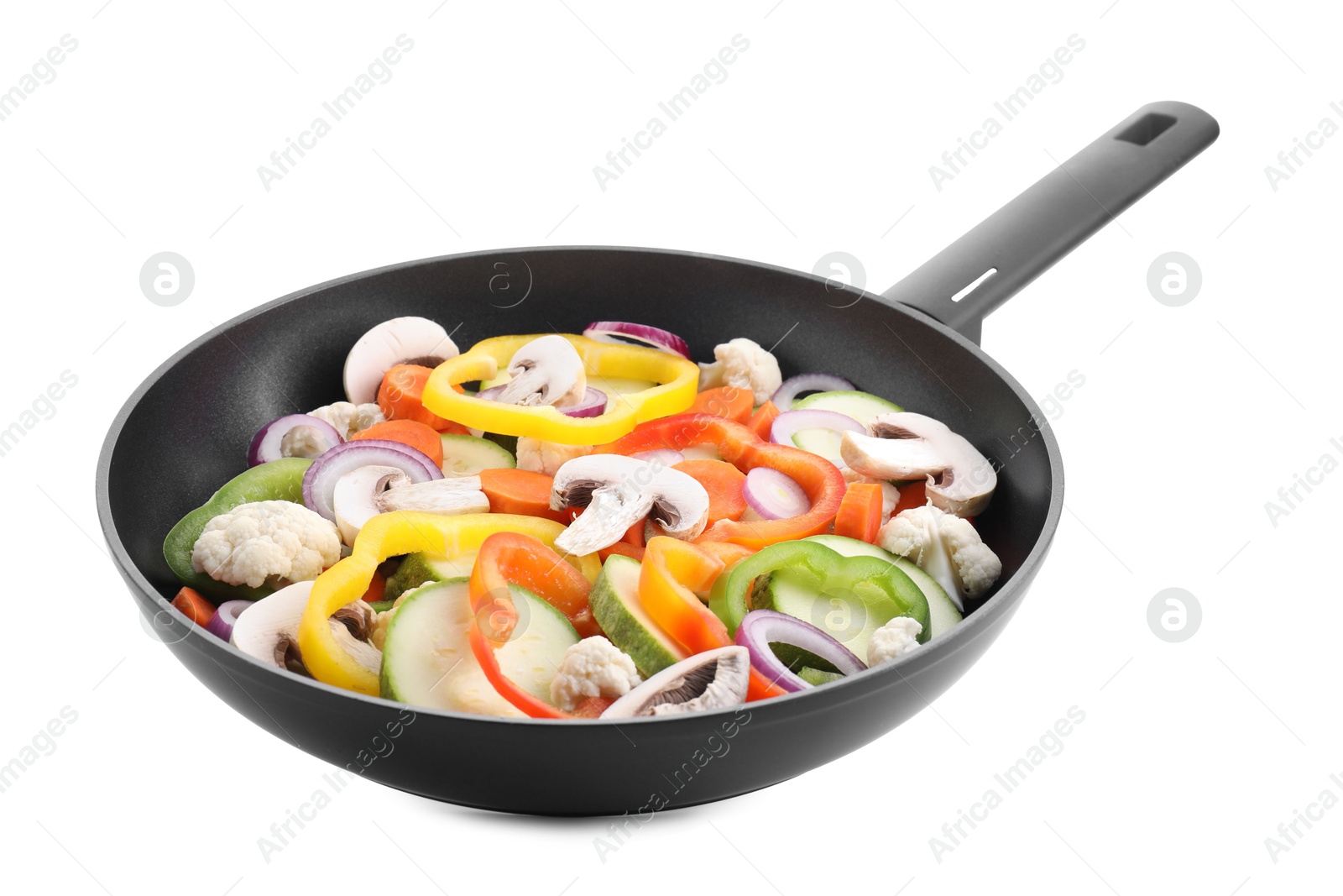 Photo of Frying pan with mix of vegetables and mushrooms in air isolated on white