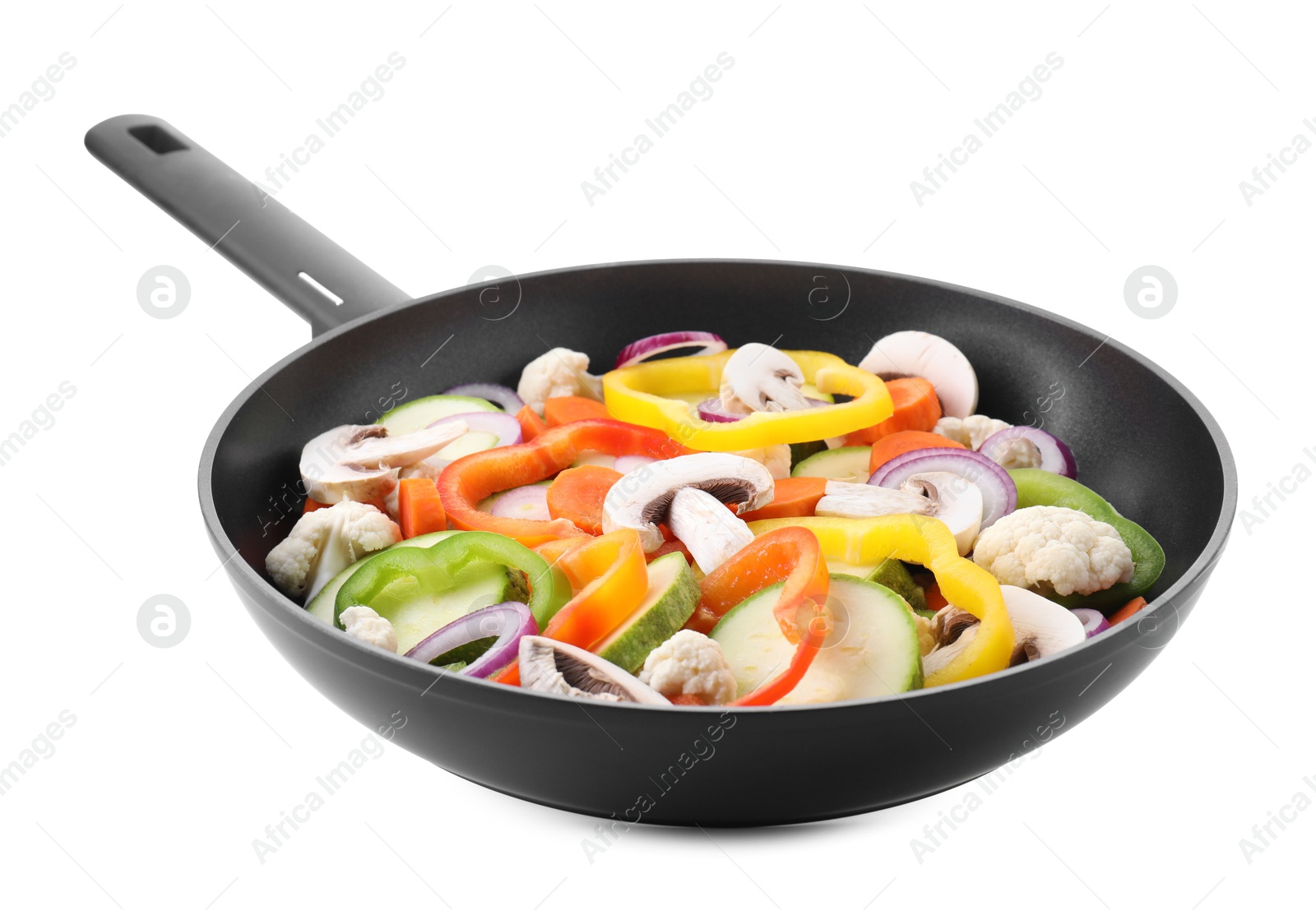 Photo of Frying pan with mix of vegetables and mushrooms in air isolated on white