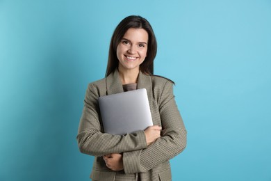 Banker with laptop on light blue background