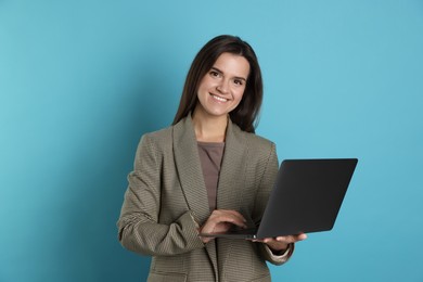 Photo of Banker with laptop on light blue background