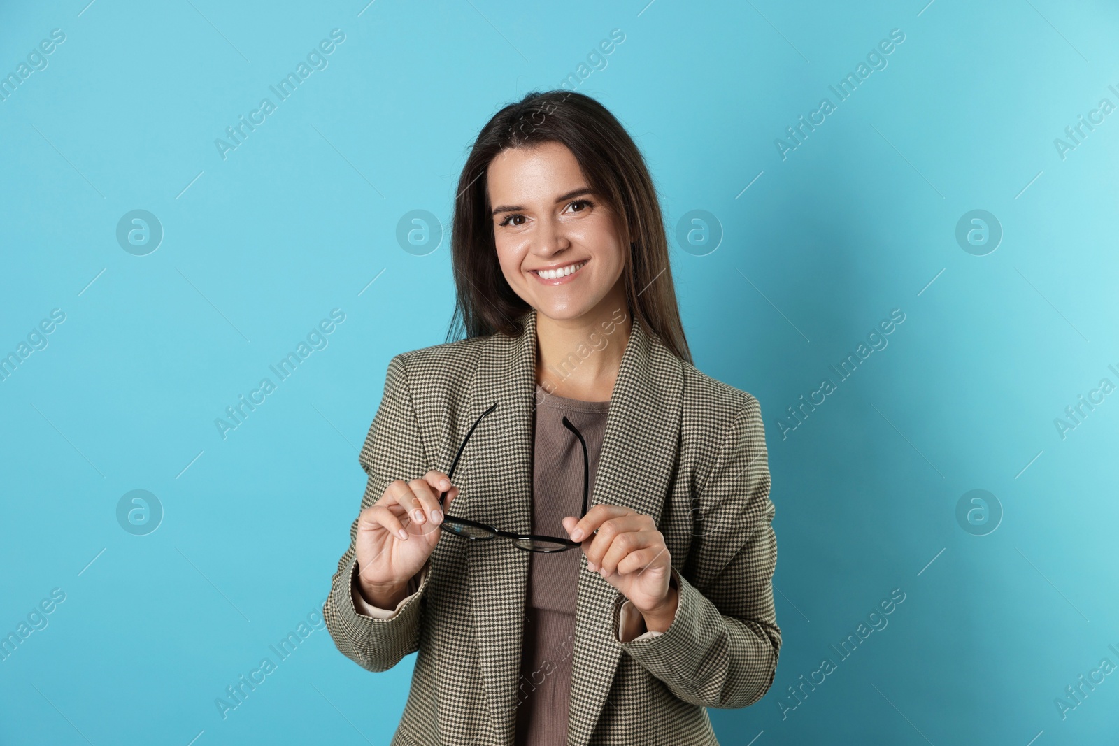 Photo of Banker with glasses on light blue background