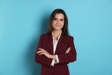 Banker with crossed arms on light blue background