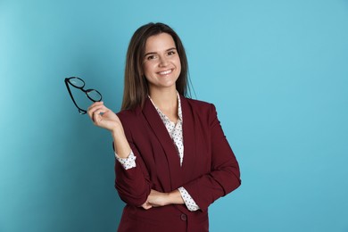 Photo of Banker with glasses on light blue background