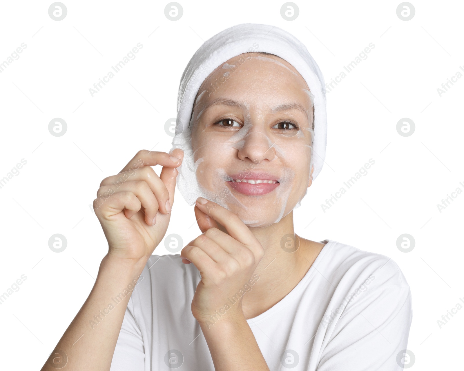 Photo of Teenage girl removing sheet facial mask on white background. Acne treatment