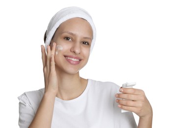 Photo of Teenage girl with acne problem applying cream on white background