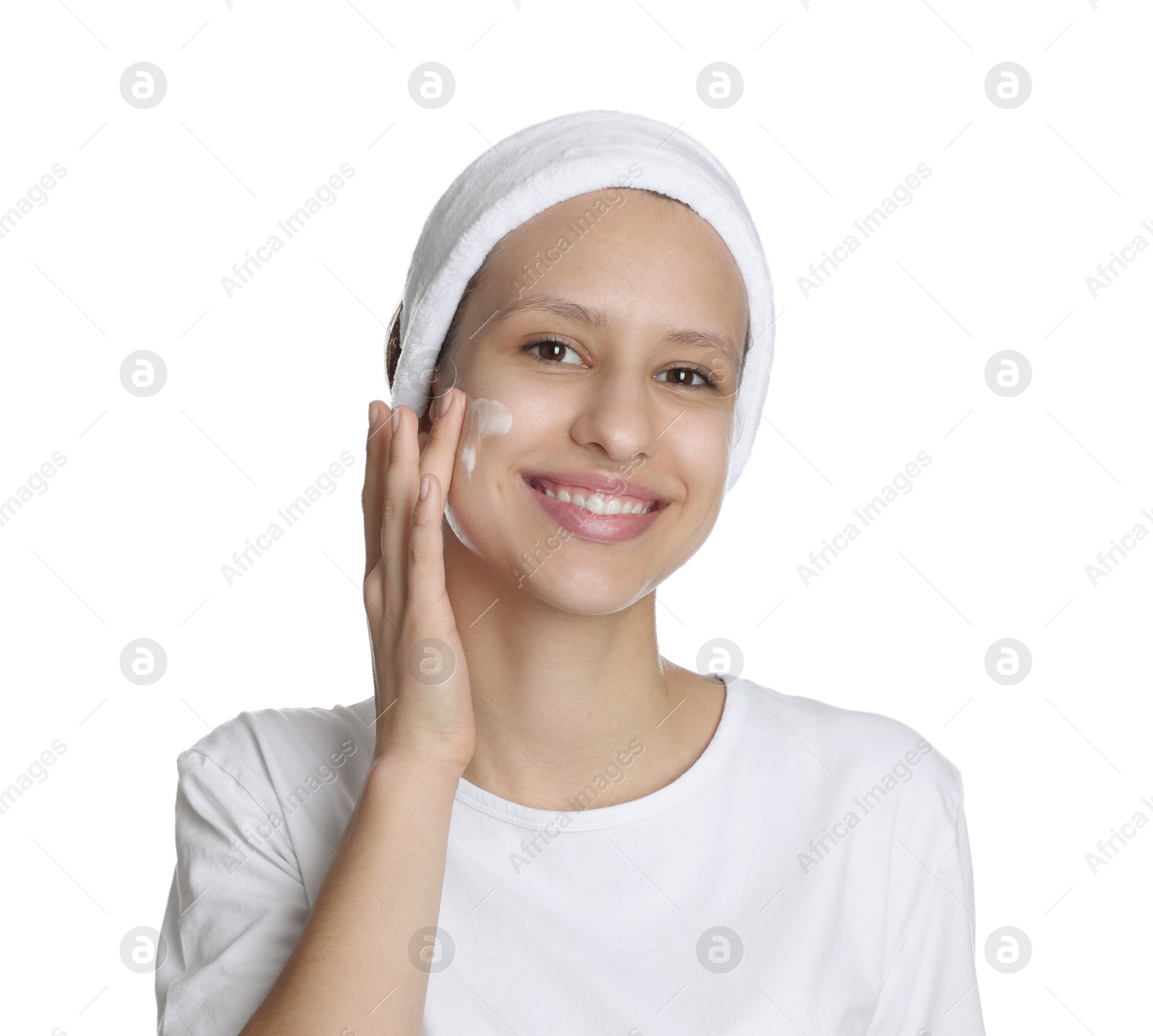 Photo of Teenage girl with acne problem applying cream on white background