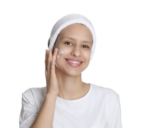 Photo of Teenage girl with acne problem applying cream on white background