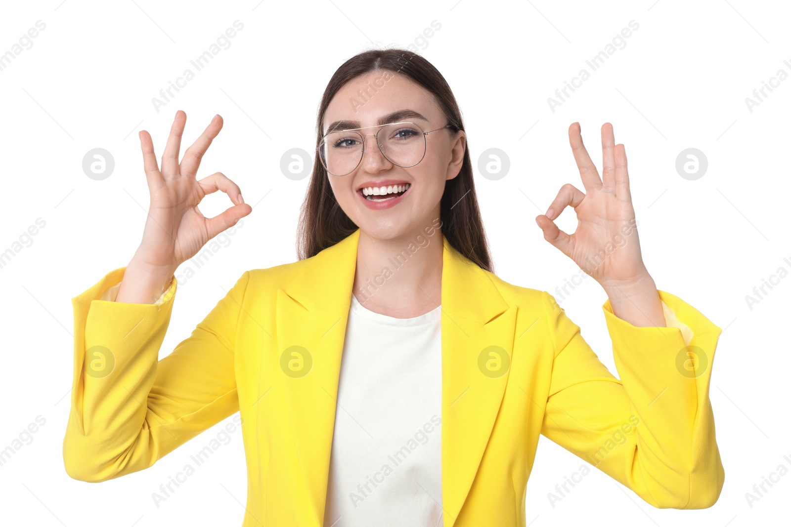 Photo of Happy young woman showing OK gesture on white background