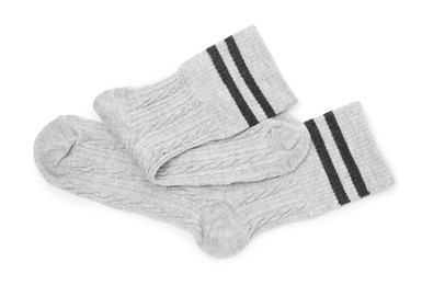 Photo of Pair of soft socks isolated on white, top view