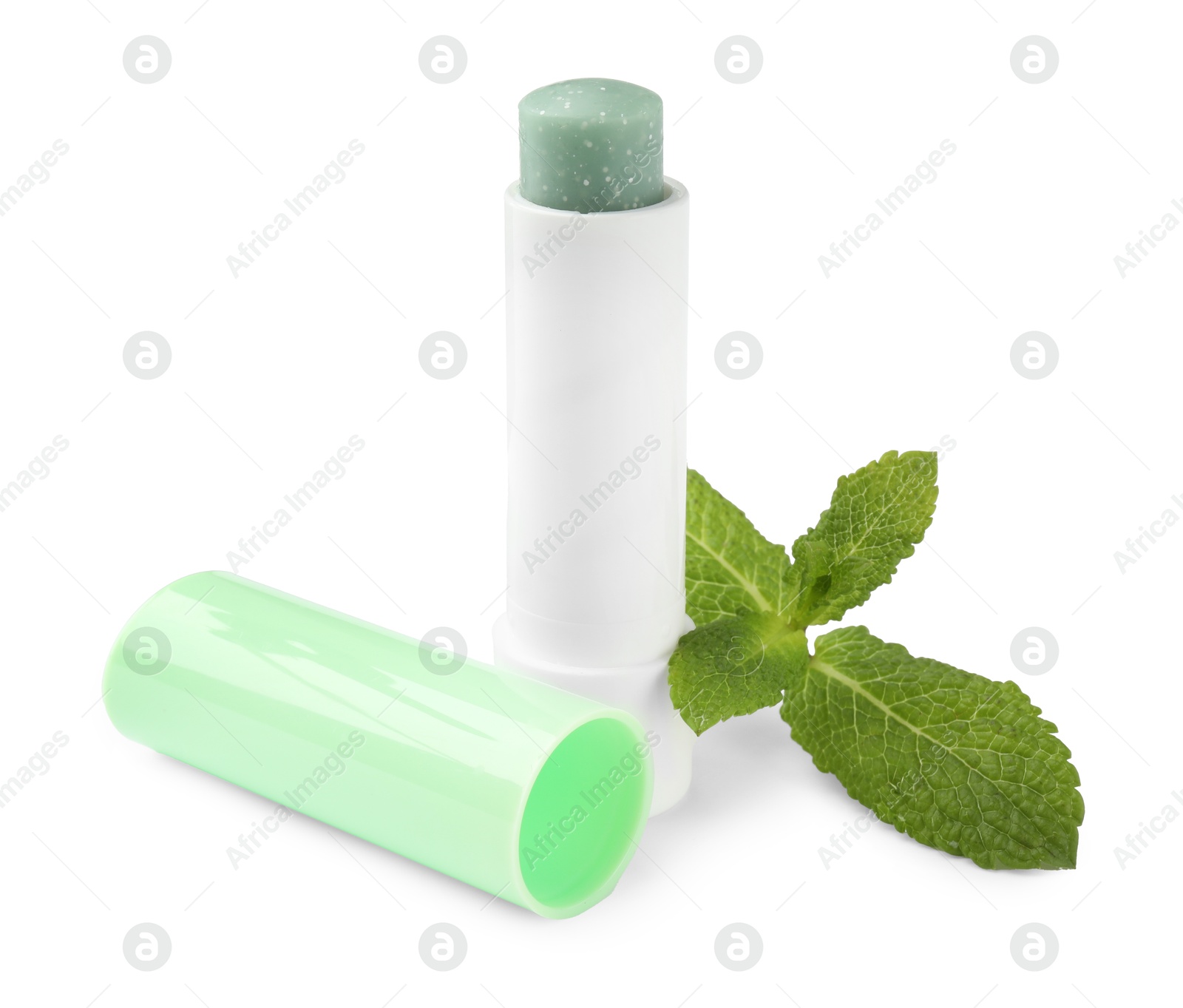 Photo of Mint lip balm and green leaves isolated on white. Cosmetic product