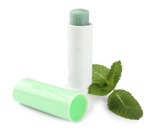 Photo of Mint lip balm and green leaves isolated on white. Cosmetic product