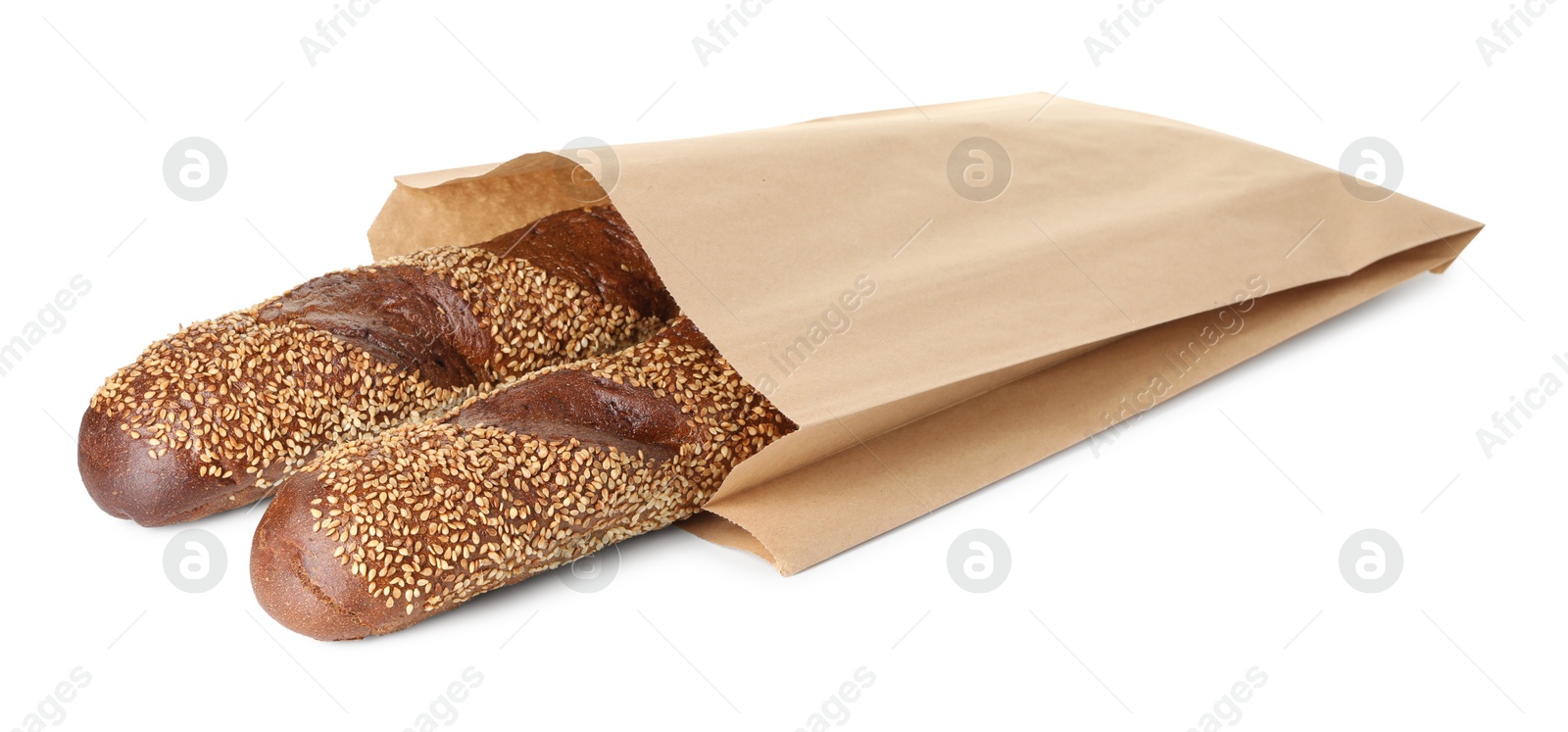 Photo of Fresh baguettes with sesame in paper bag isolated on white