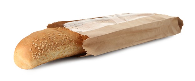 Photo of Fresh baguette with sesame in paper bag isolated on white