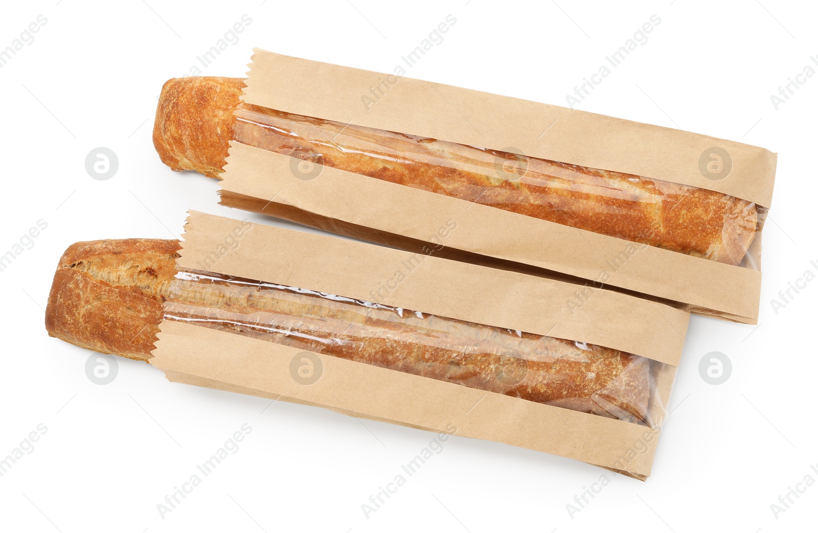 Photo of Fresh baguettes in paper bags isolated on white, top view