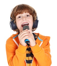 Photo of Little boy with microphone and headphones singing on white background