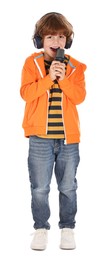 Little boy with microphone and headphones singing on white background