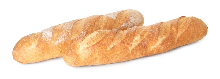 Photo of Two freshly baked baguettes isolated on white