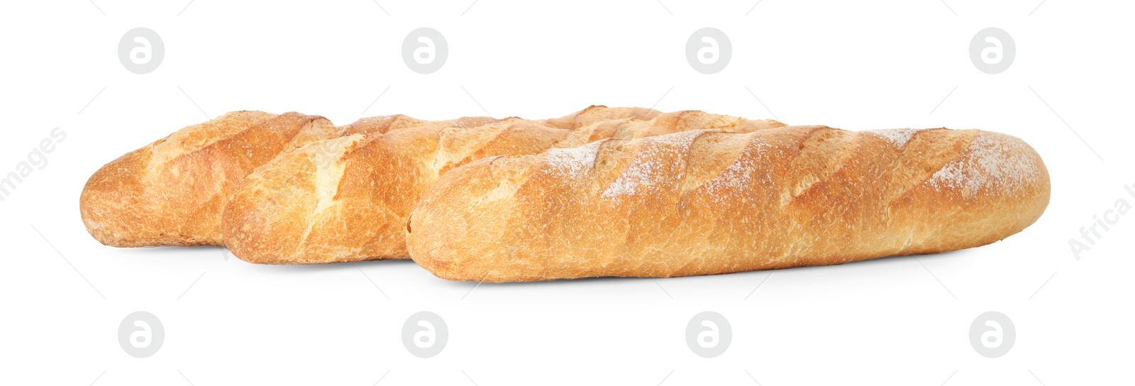 Photo of Three freshly baked baguettes isolated on white