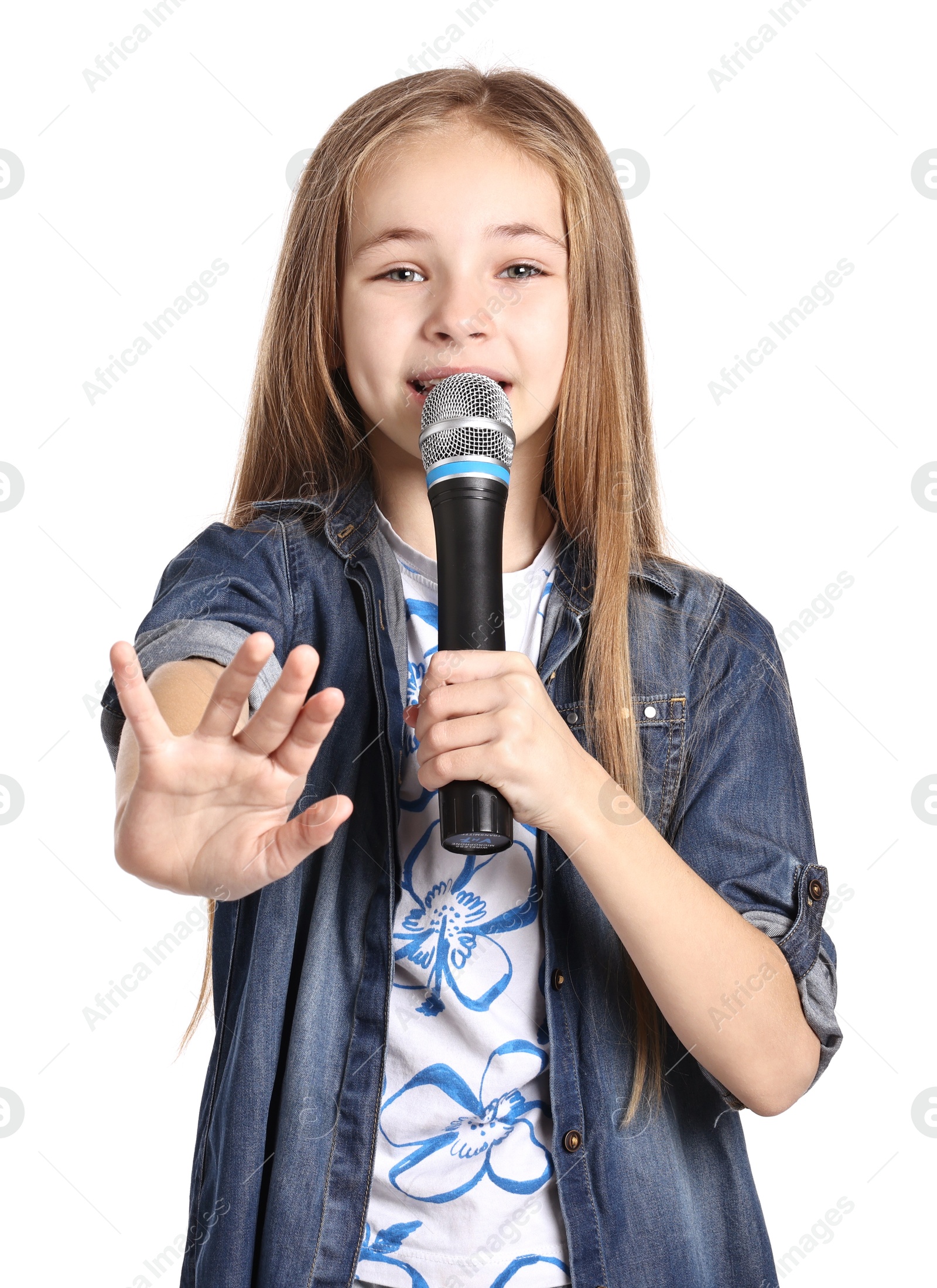 Photo of Little girl with microphone singing on white background