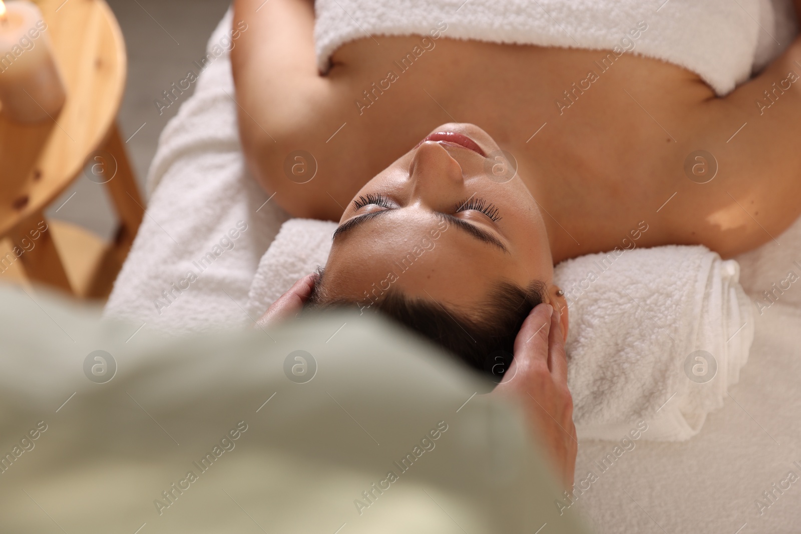 Photo of Woman receiving massage in spa salon, above view