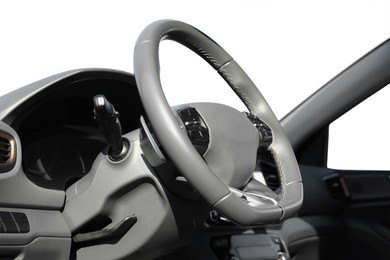 Image of Steering wheel and dashboard in modern car. White background