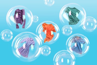 Image of Several soap bubbles with clothes inside and empty ones floating on light blue background. Laundry day