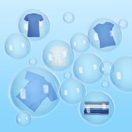 Image of Several soap bubbles with laundry inside and empty ones floating on light blue background