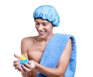 Happy man with shower cap, towel, bath duck and mesh sponge on white background