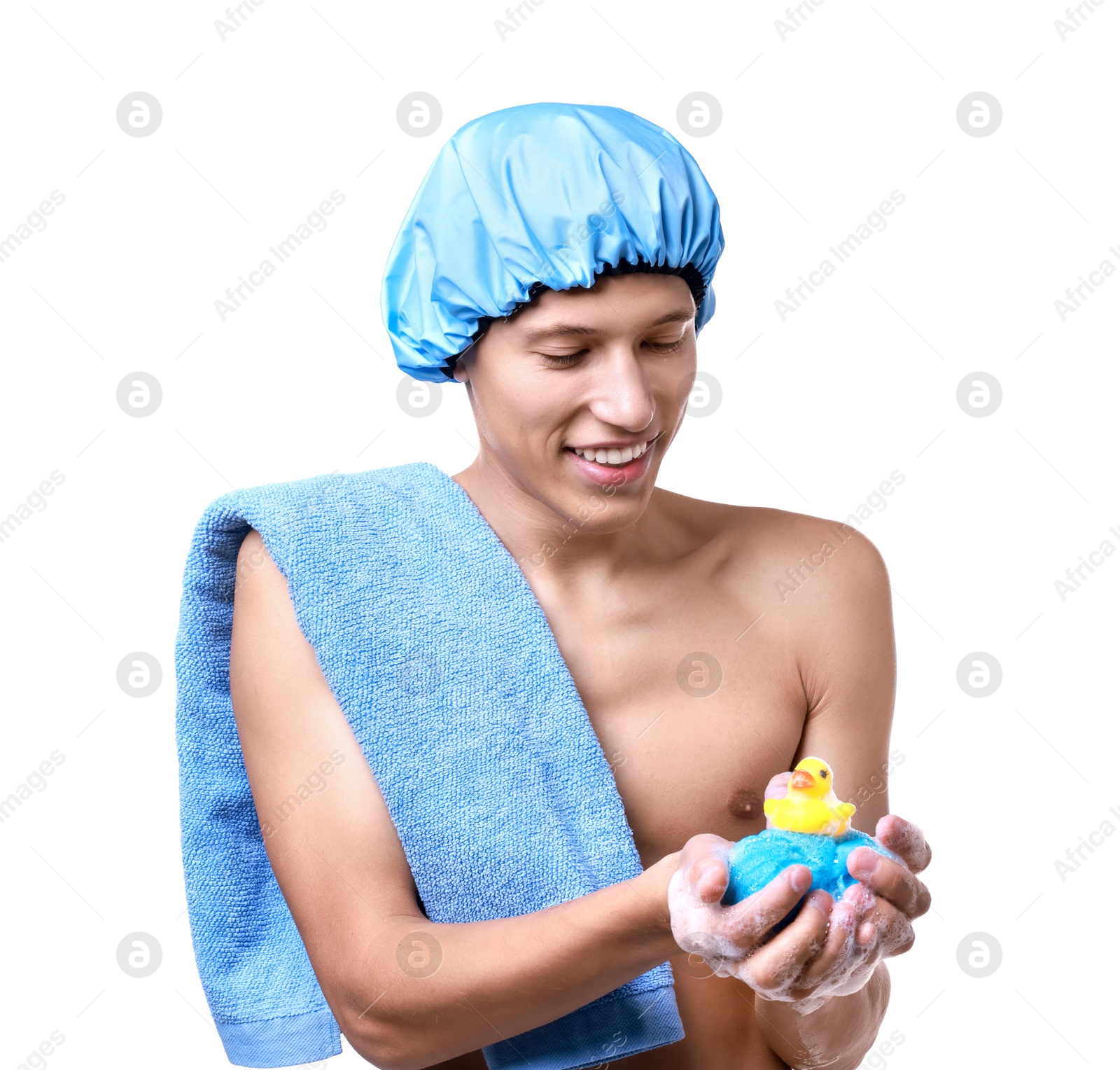 Photo of Happy man with shower cap, towel, bath duck and mesh sponge on white background