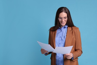 Photo of Banker with documents on light blue background, space for text