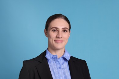 Photo of Portrait of banker on light blue background