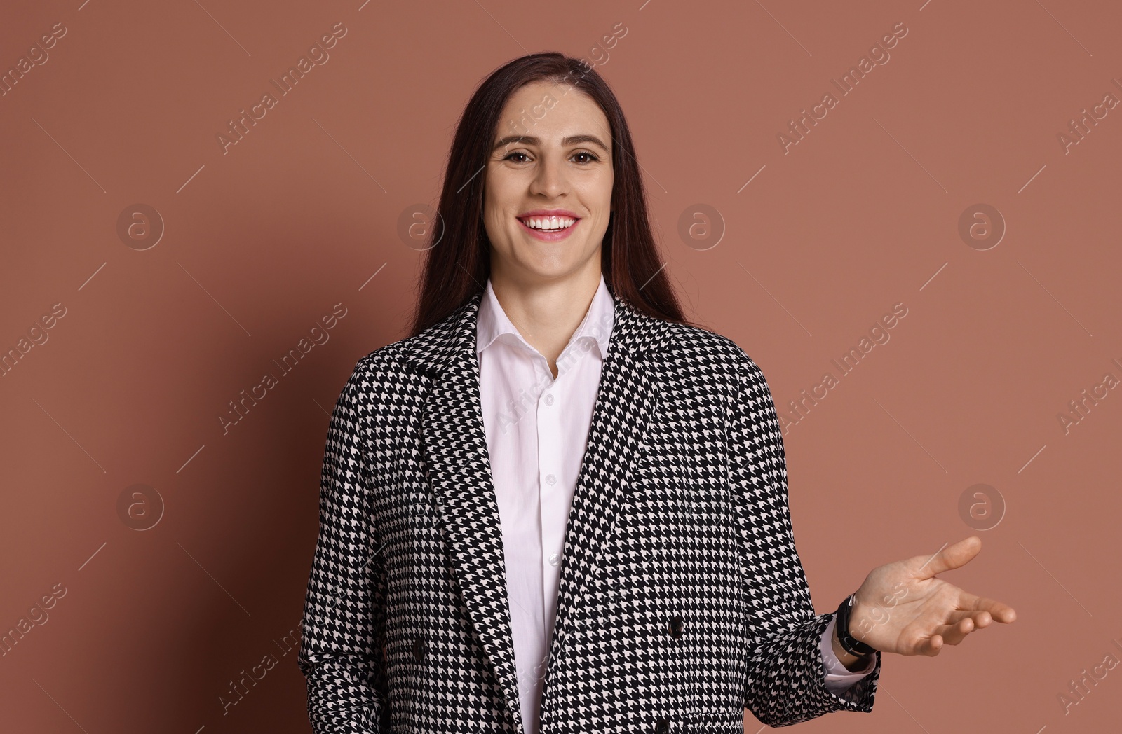 Photo of Portrait of banker in jacket on brown background