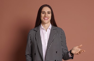 Photo of Portrait of banker in jacket on brown background