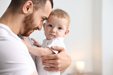 Photo of Dad with his cute little baby at home