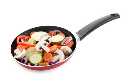 Photo of Frying pan with mix of fresh vegetables and mushrooms in air isolated on white