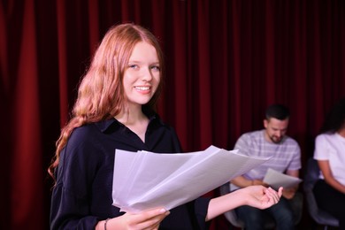 Professional actress rehearsing on stage in theatre