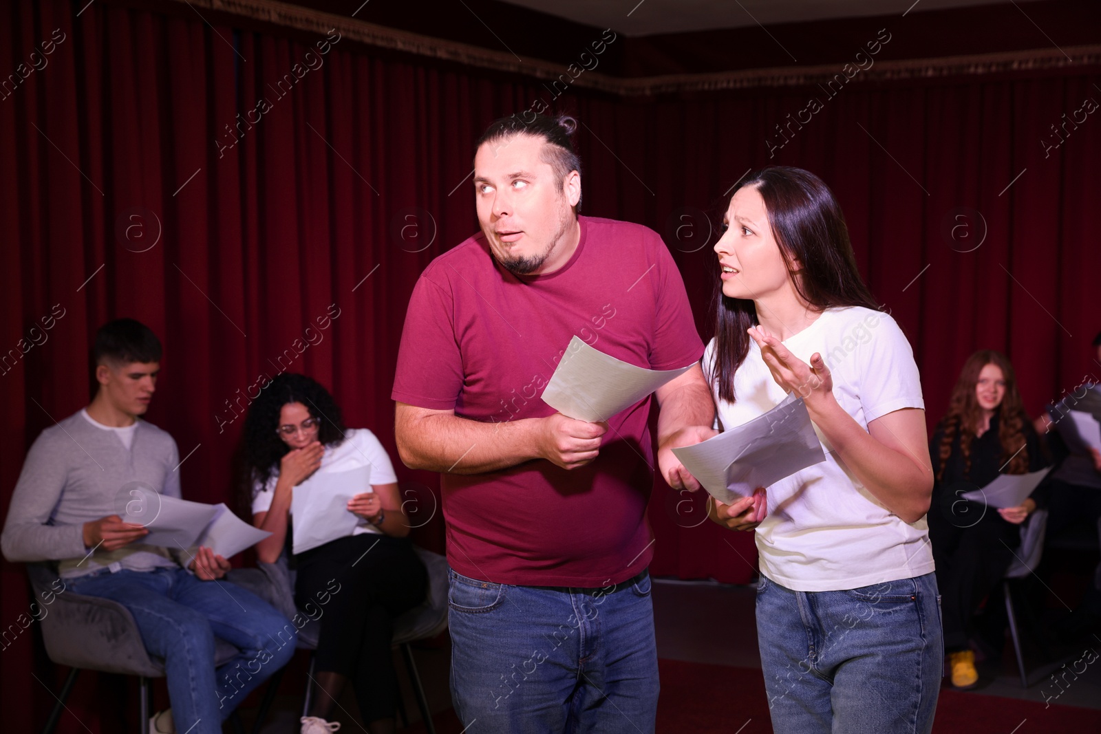 Photo of Professional actors rehearsing on stage in theatre