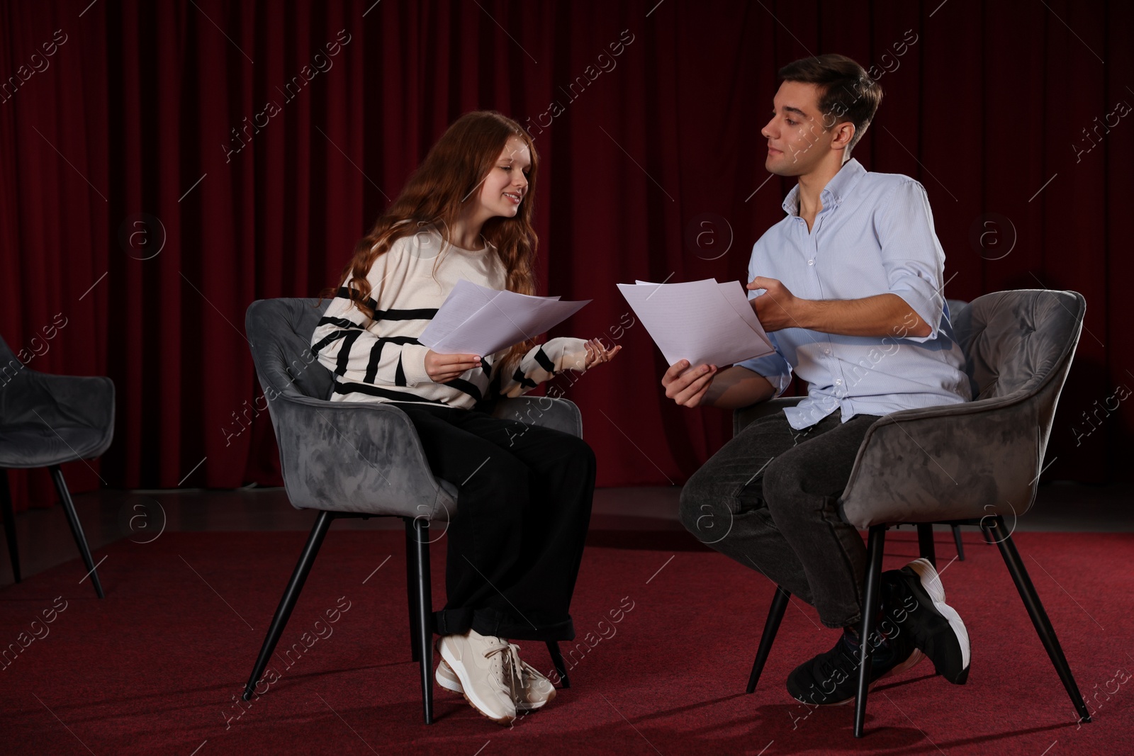 Photo of Professional actors rehearsing on stage in theatre