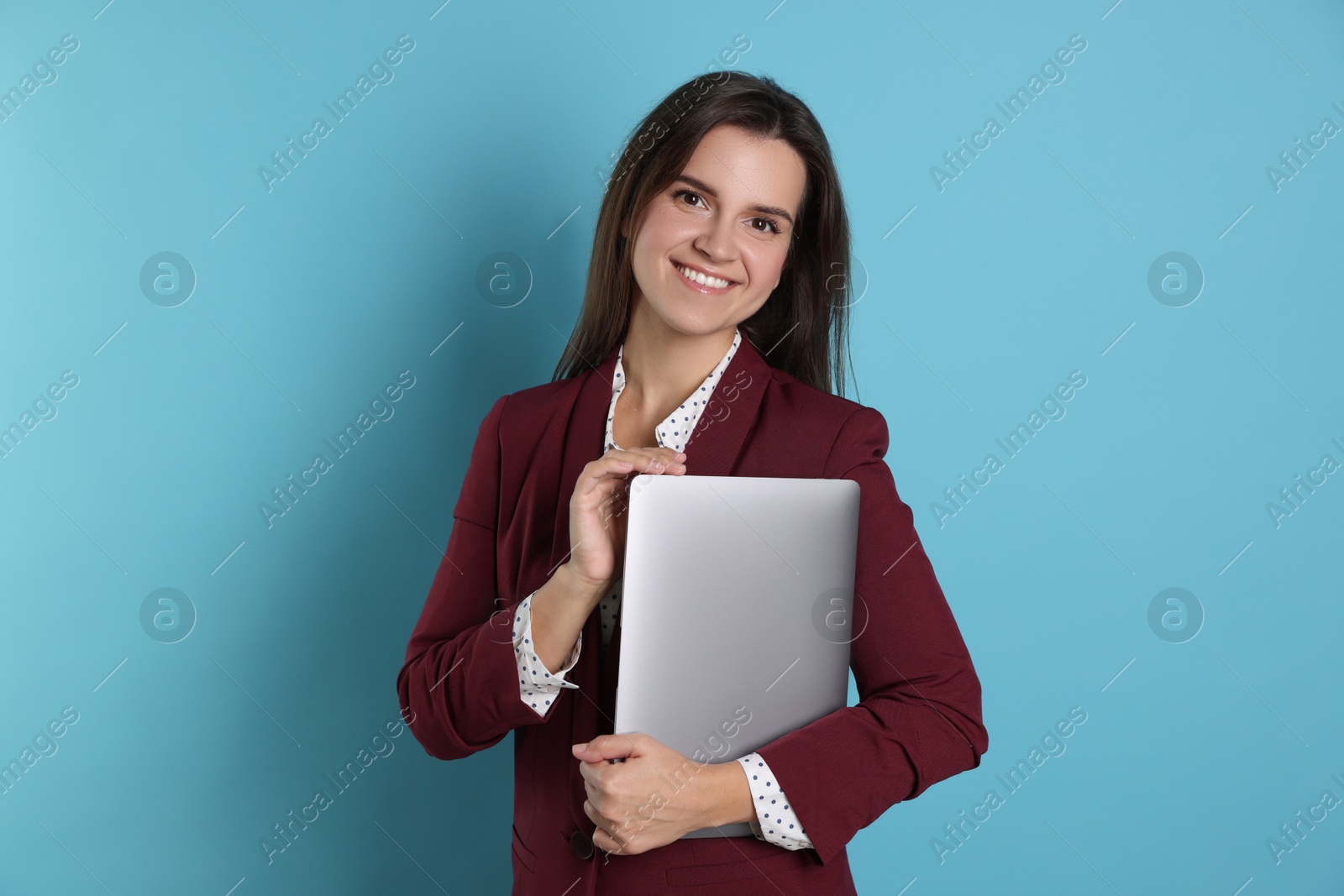 Photo of Banker with laptop on light blue background