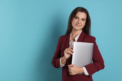 Photo of Banker with laptop on light blue background, space for text