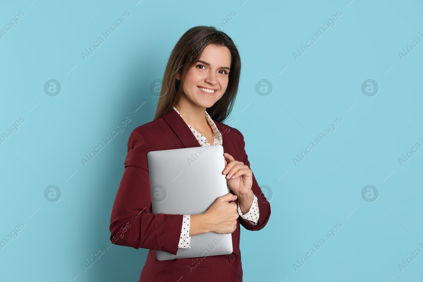 Photo of Banker with laptop on light blue background